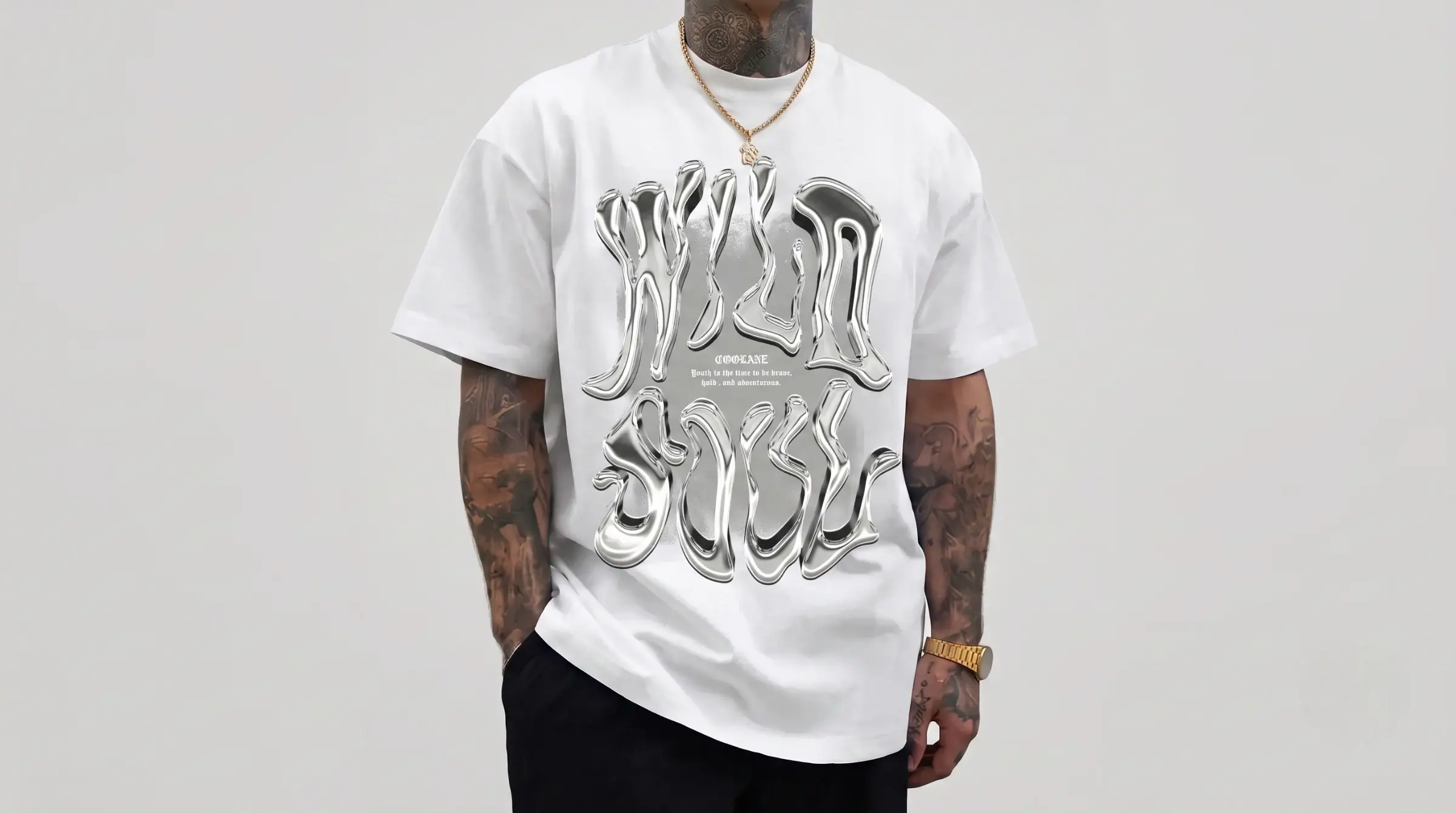 Model wearing a metallic graphic tee with a shiny Y2K-inspired design